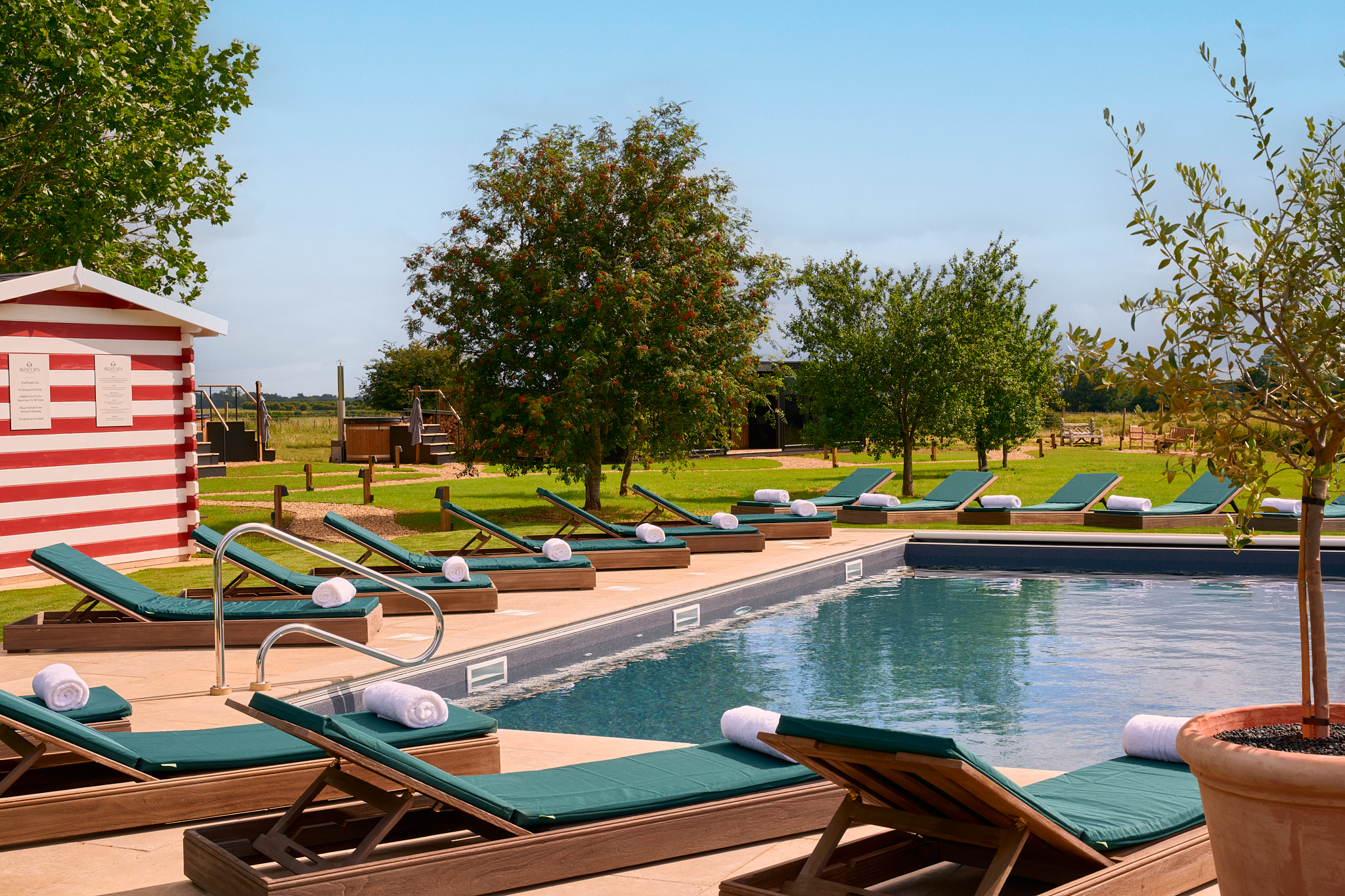 The Barnsdale lodge pool with sunbeds around the outside.