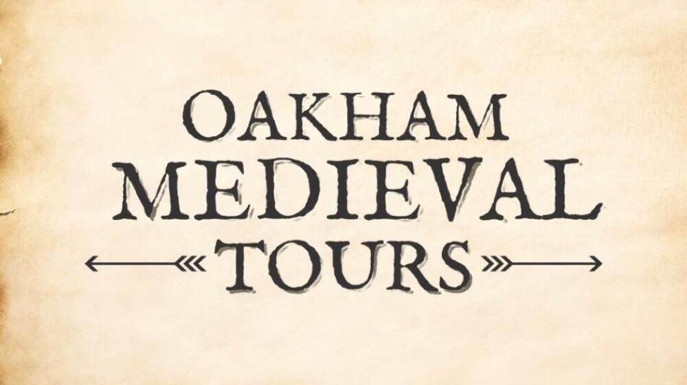 A guided tour of Oakham's historic medieval sites, with visitors exploring ancient landmarks and learning about the town's rich history.