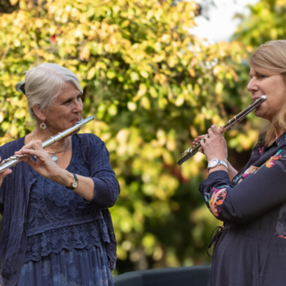 ann-and-julie-playing-flutes-in-the-garden-640
